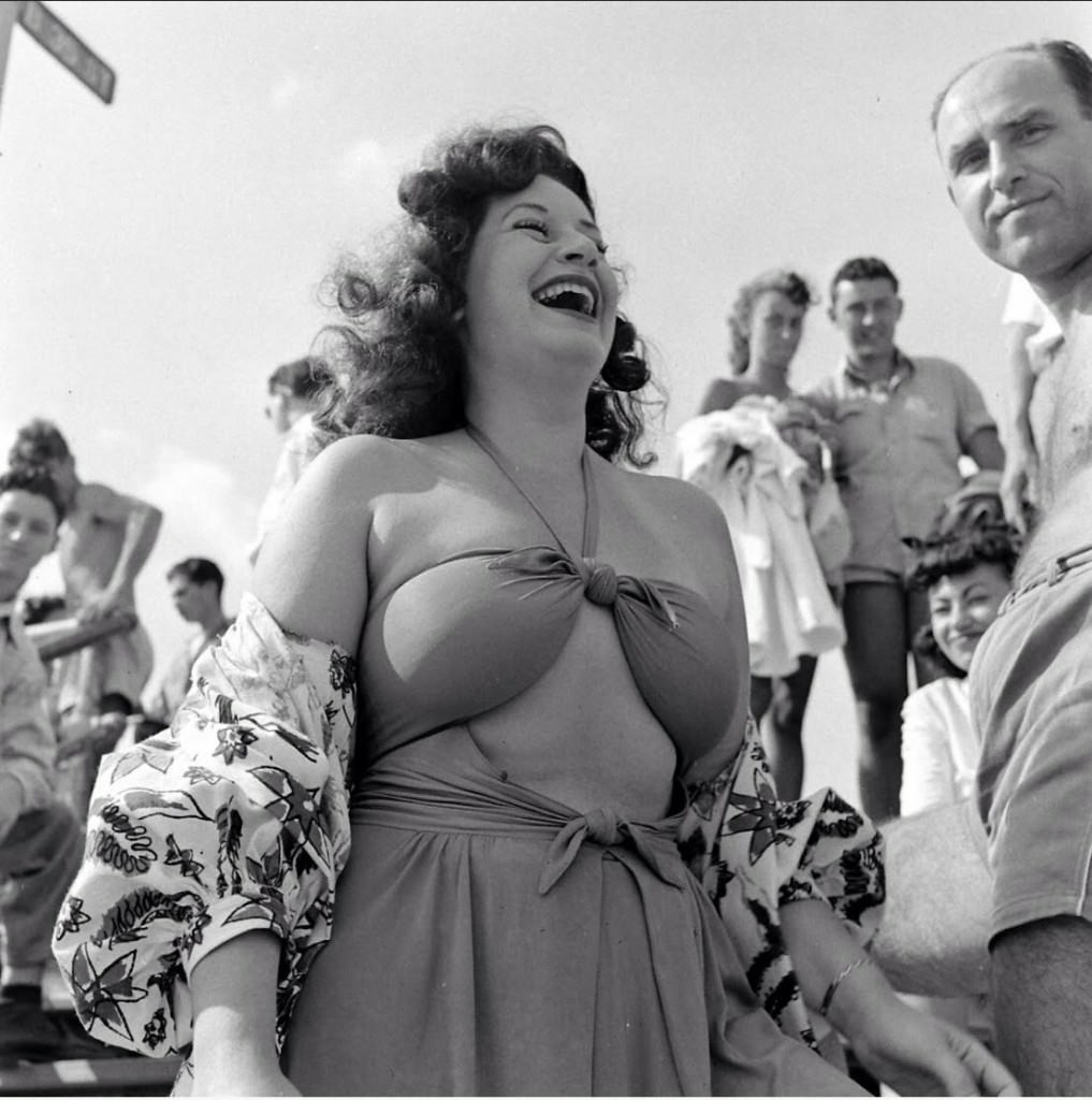 People being ticketed for 'Indecent Exposure' at Rockaway Beach of New York City, 1946