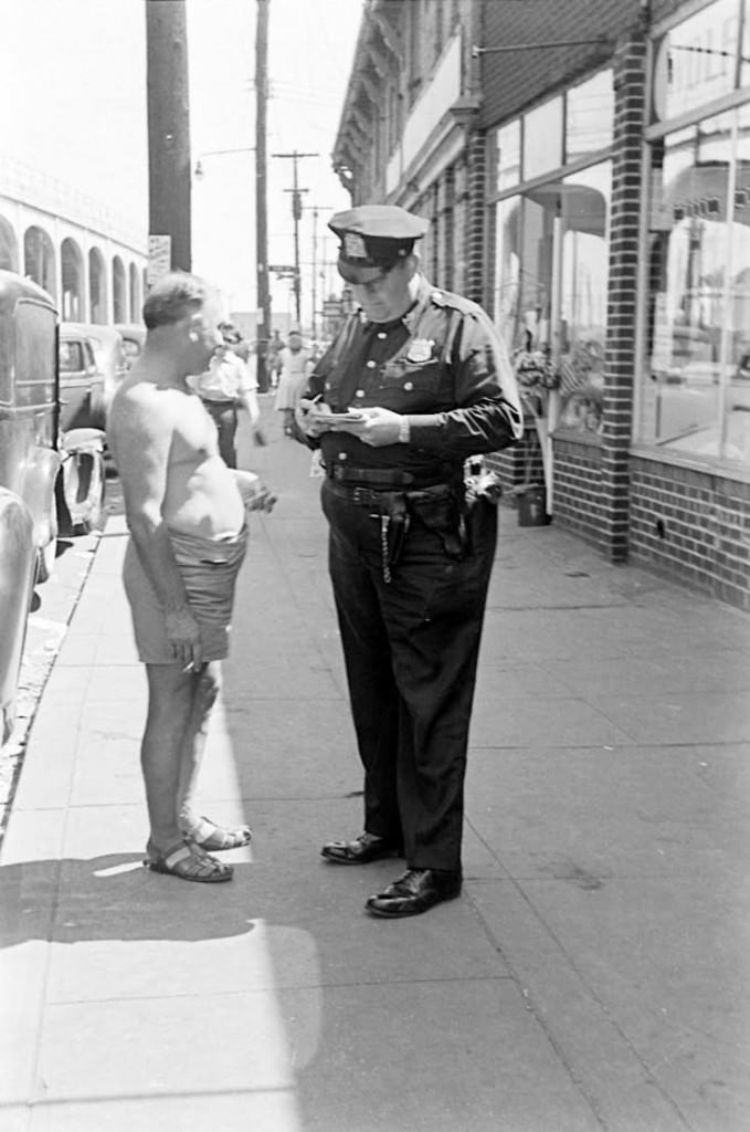 People being ticketed for 'Indecent Exposure' at Rockaway Beach of New York City, 1946