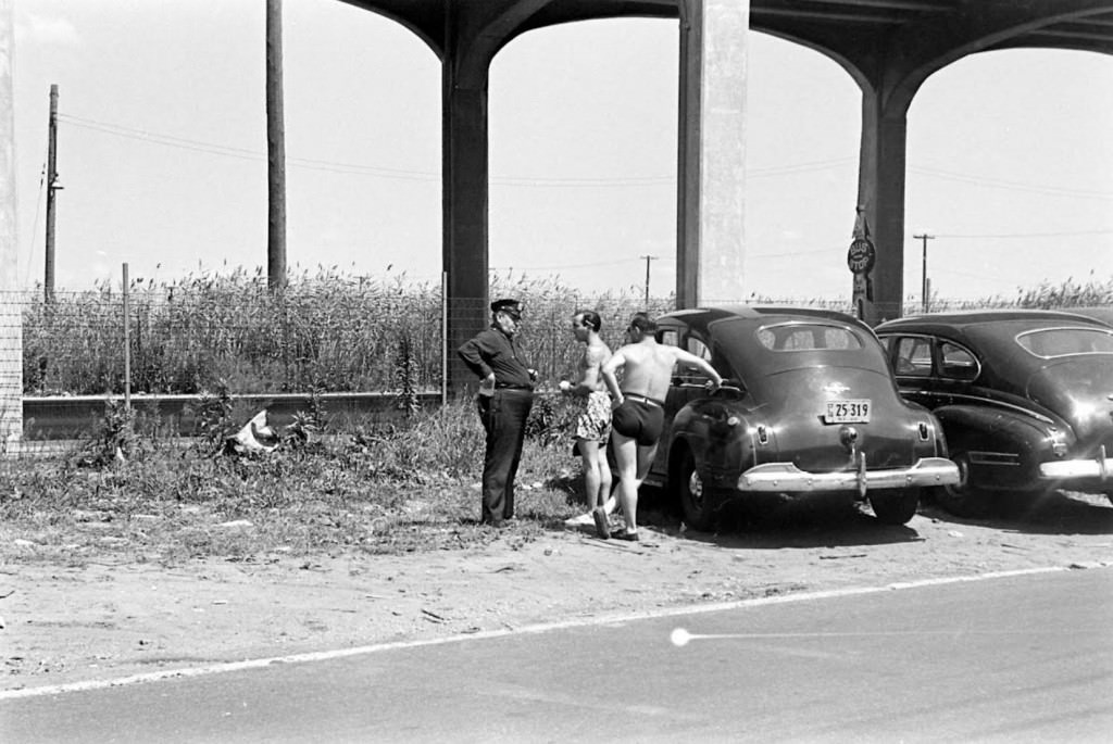 People being ticketed for 'Indecent Exposure' at Rockaway Beach of New York City, 1946