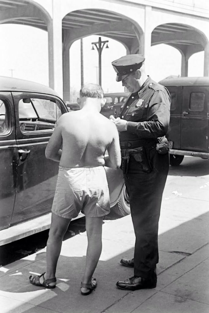 People being ticketed for 'Indecent Exposure' at Rockaway Beach of New York City, 1946