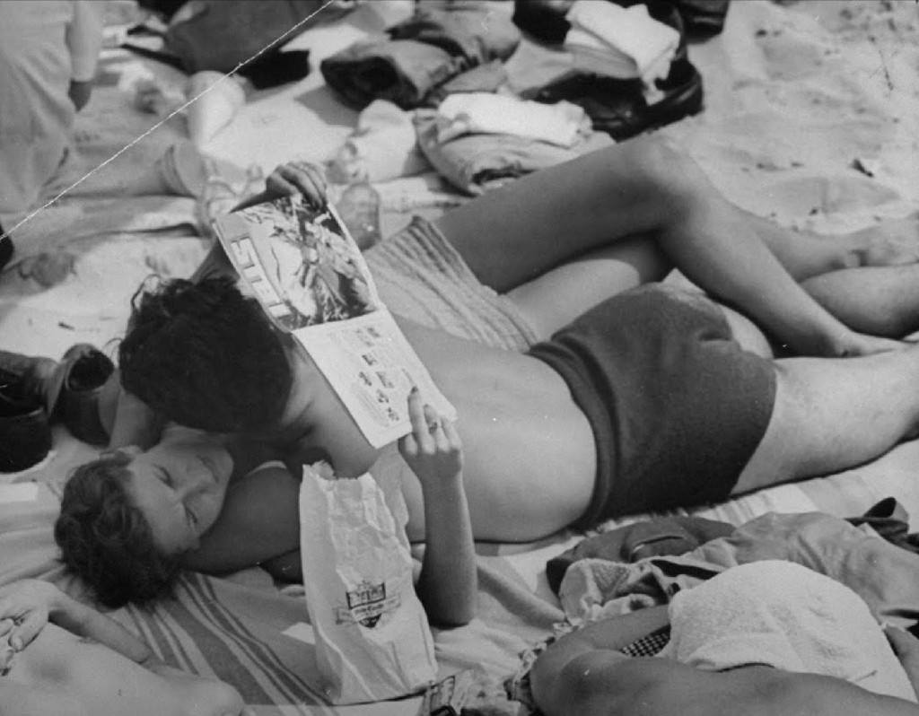 People being ticketed for 'Indecent Exposure' at Rockaway Beach of New York City, 1946