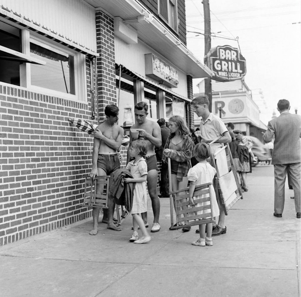 People being ticketed for 'Indecent Exposure' at Rockaway Beach of New York City, 1946