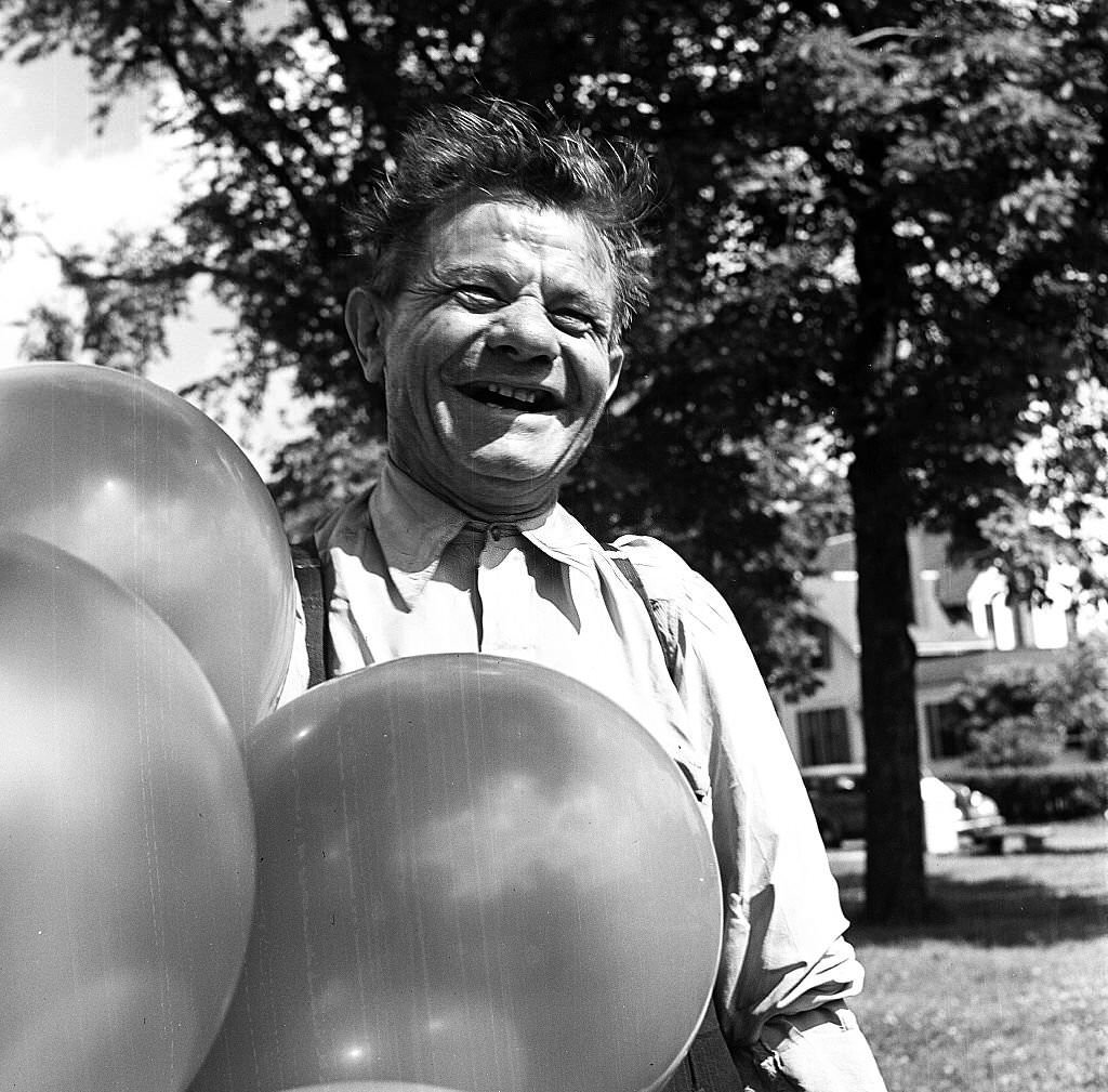 Portrait of a balloon seller smiling, Provincetown, Massachusetts, 1948.