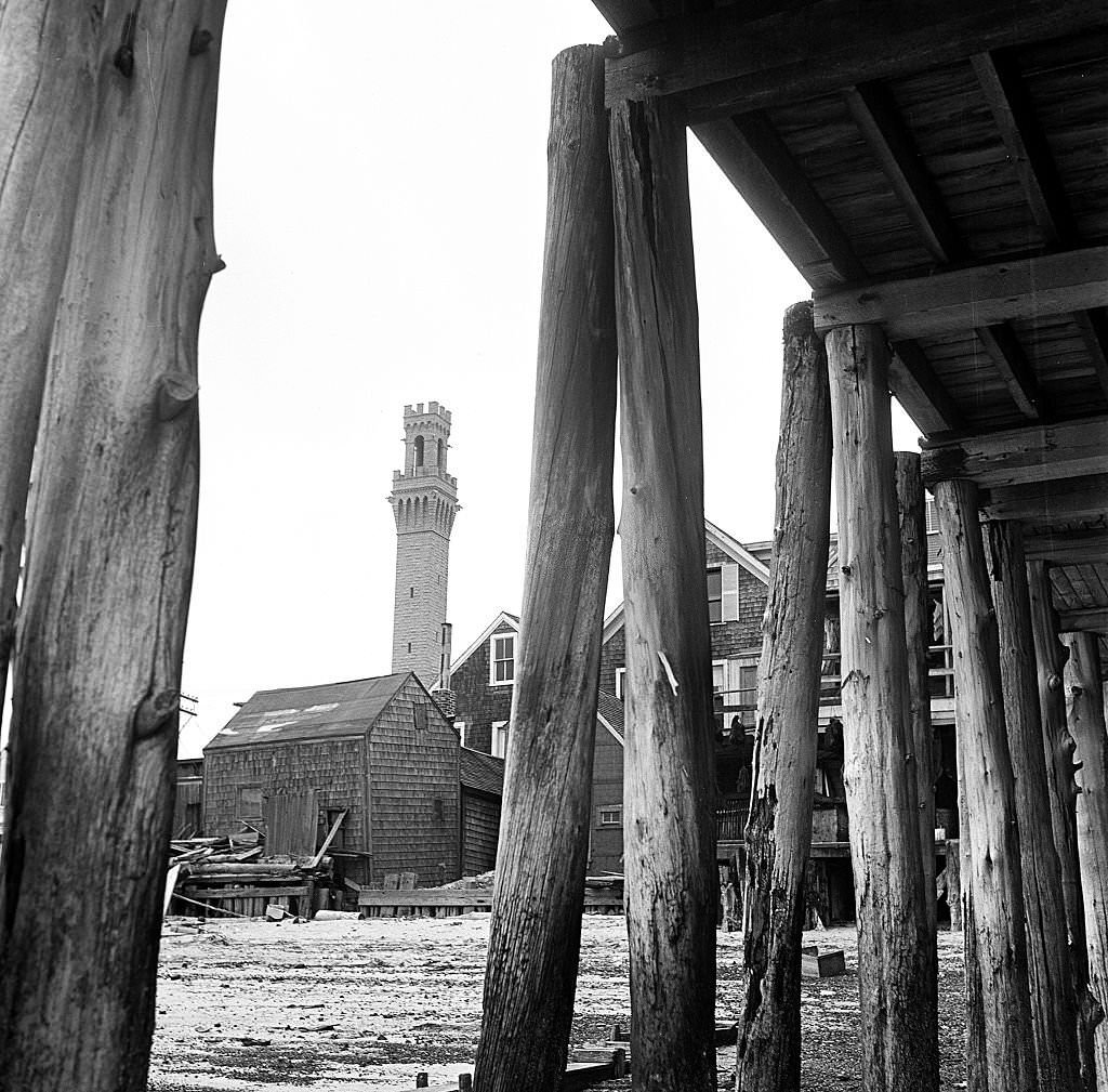 View showing the Pilgrim's Monument, at left, taken from beneath the piers, Provincetown, Massachusetts, 1948.