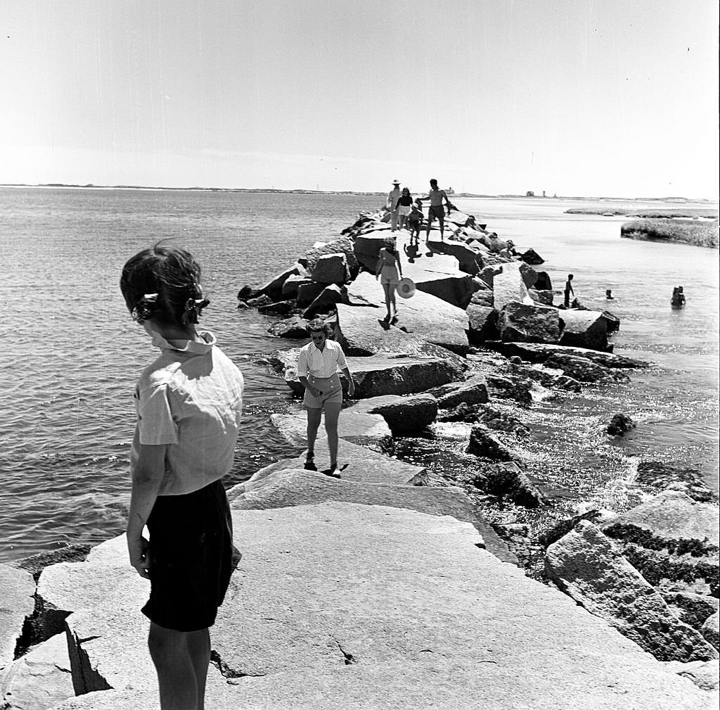 Visitors walk along the breakwater, Provincetown, Massachusetts, 1948.