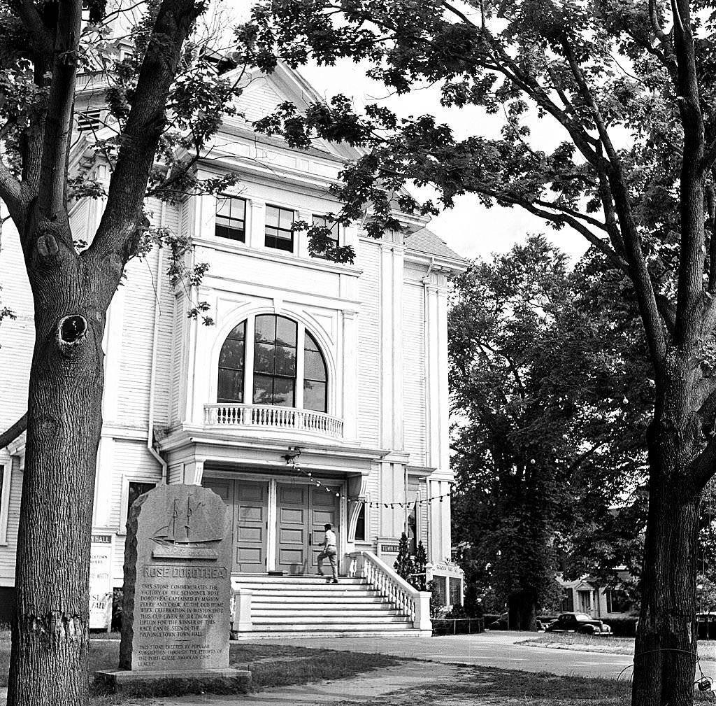 Outside the Town Hall, view of a monument to the Rose Dorothea commemorating her victory at Old Home Week in Boston, Provincetown, Massachusetts, 1948.