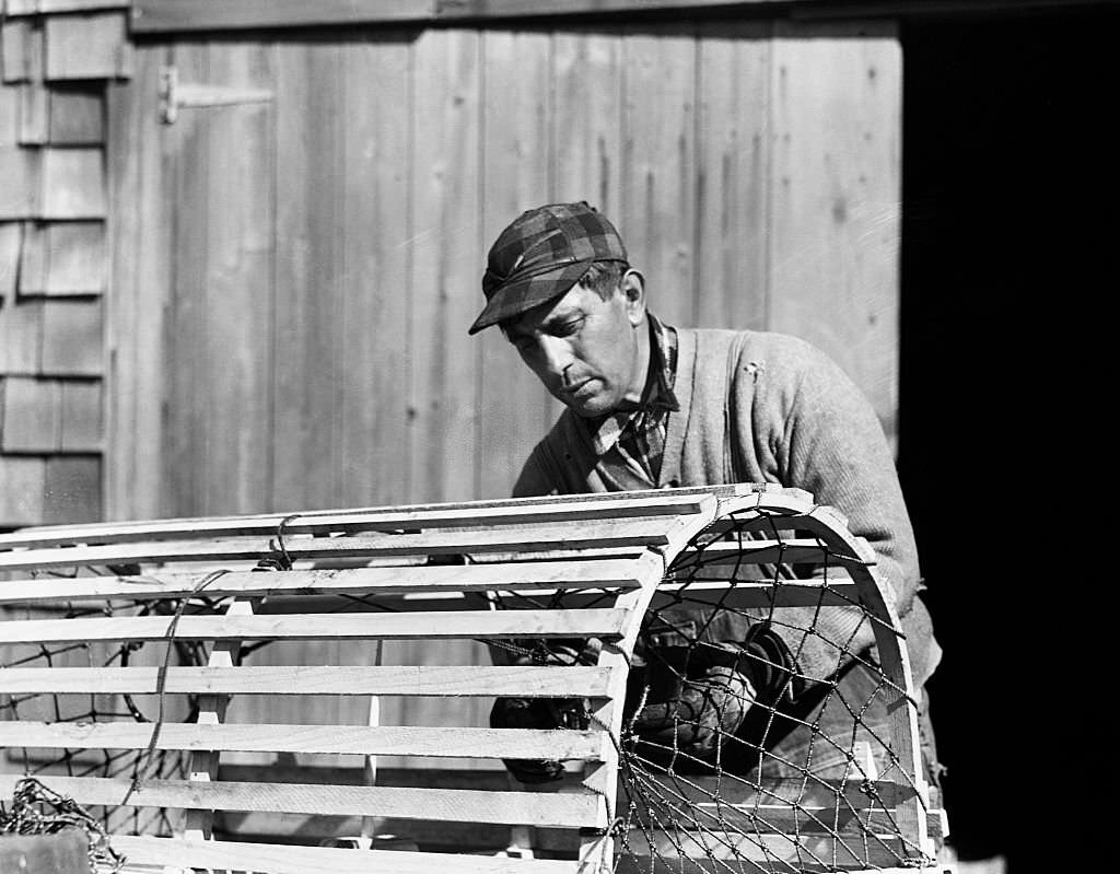 A Portuguese crab fisherman preparing one of his traps. Provincetown, Massachusetts, April 1942.