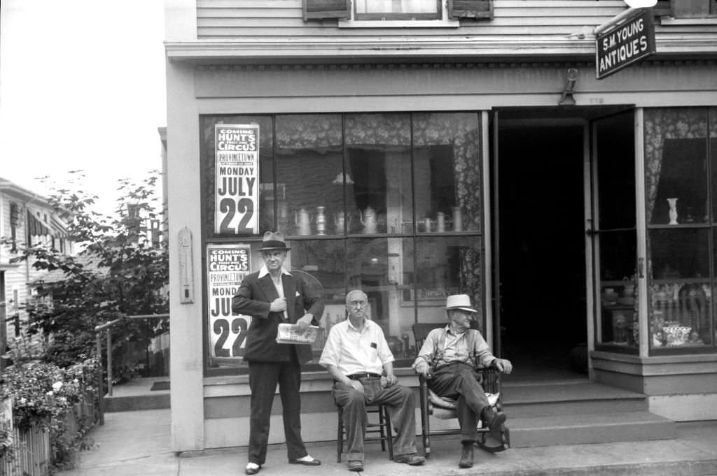 Three Men Relaxing in front of Antiques Shop, Provincetown, Massachusetts, USA, Edwin Rosskam for Farm Security Administration, August 1940.
