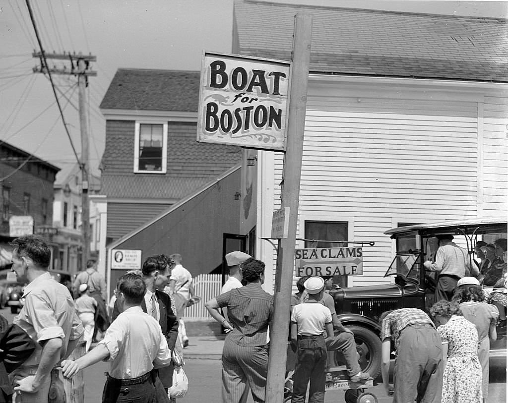 Tourists just off the boat from Boston beginning to make use of their two hours in town. Provincetown, Massachusetts, August 1940.
