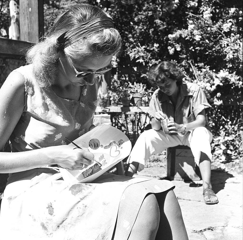 Employees paint or repair items which will be for sale at an antique shop, Provincetown, Massachusetts, 1948.