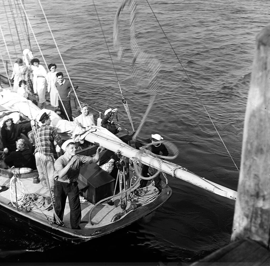 Visitors disembark from a boat at the pier, Provincetown, Massachusetts, 1948.