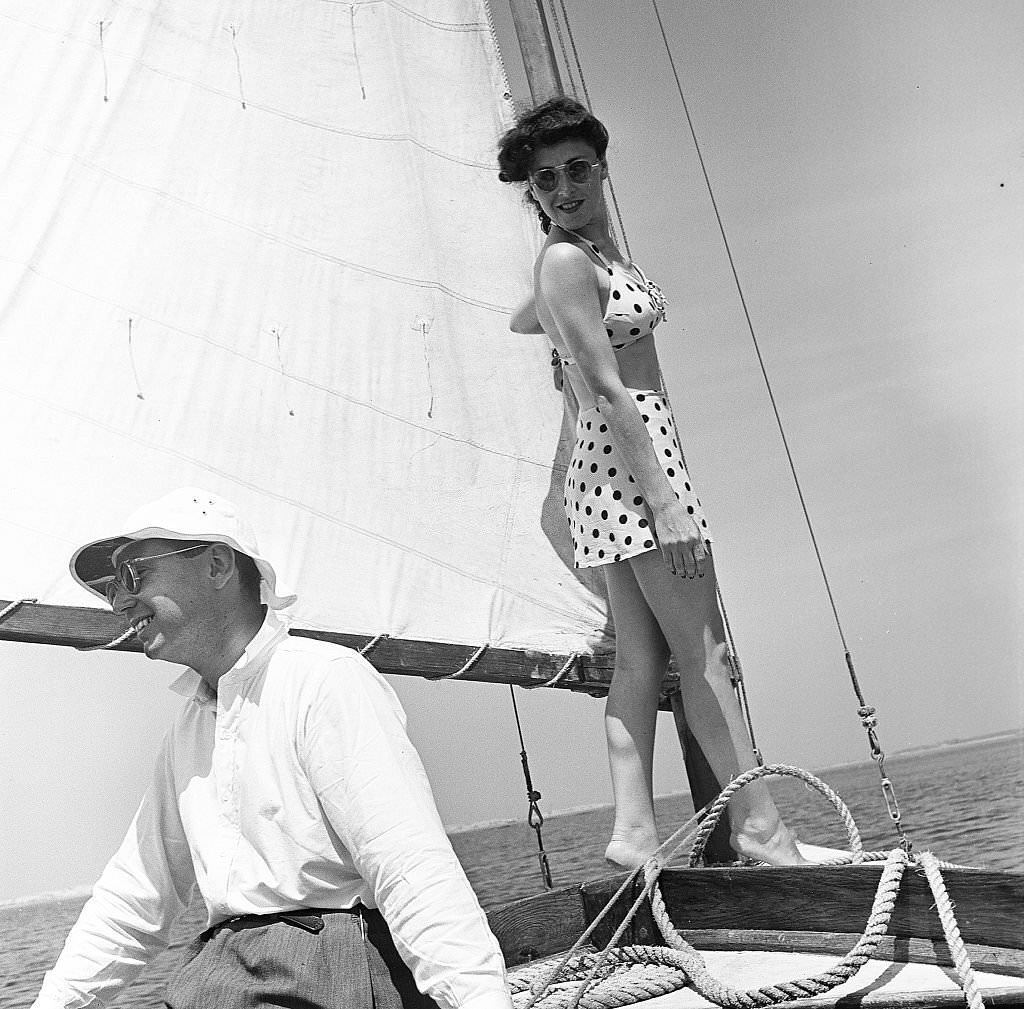 A man and a woman enjoy sailing on the waters off Provincetown on Cape Cod, near Provincetown, Massachussetts, 1947.