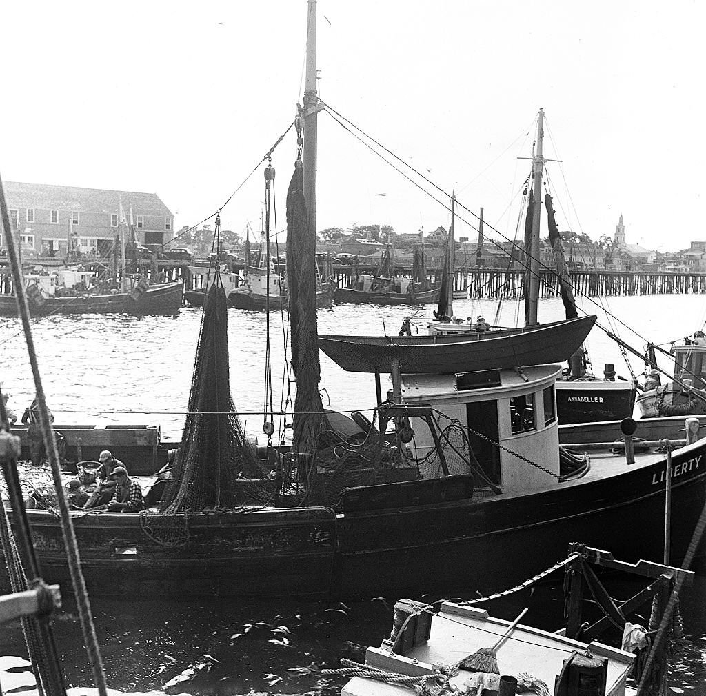 Fishing boats docked on a pier on Cape Cod, Provincetown, Massachussetts, 1947.