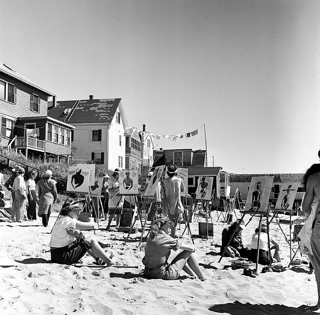 A group of painters set up their easels and paint while on the beach on Cape Cod, Provincetown, Massachussetts, 1947.