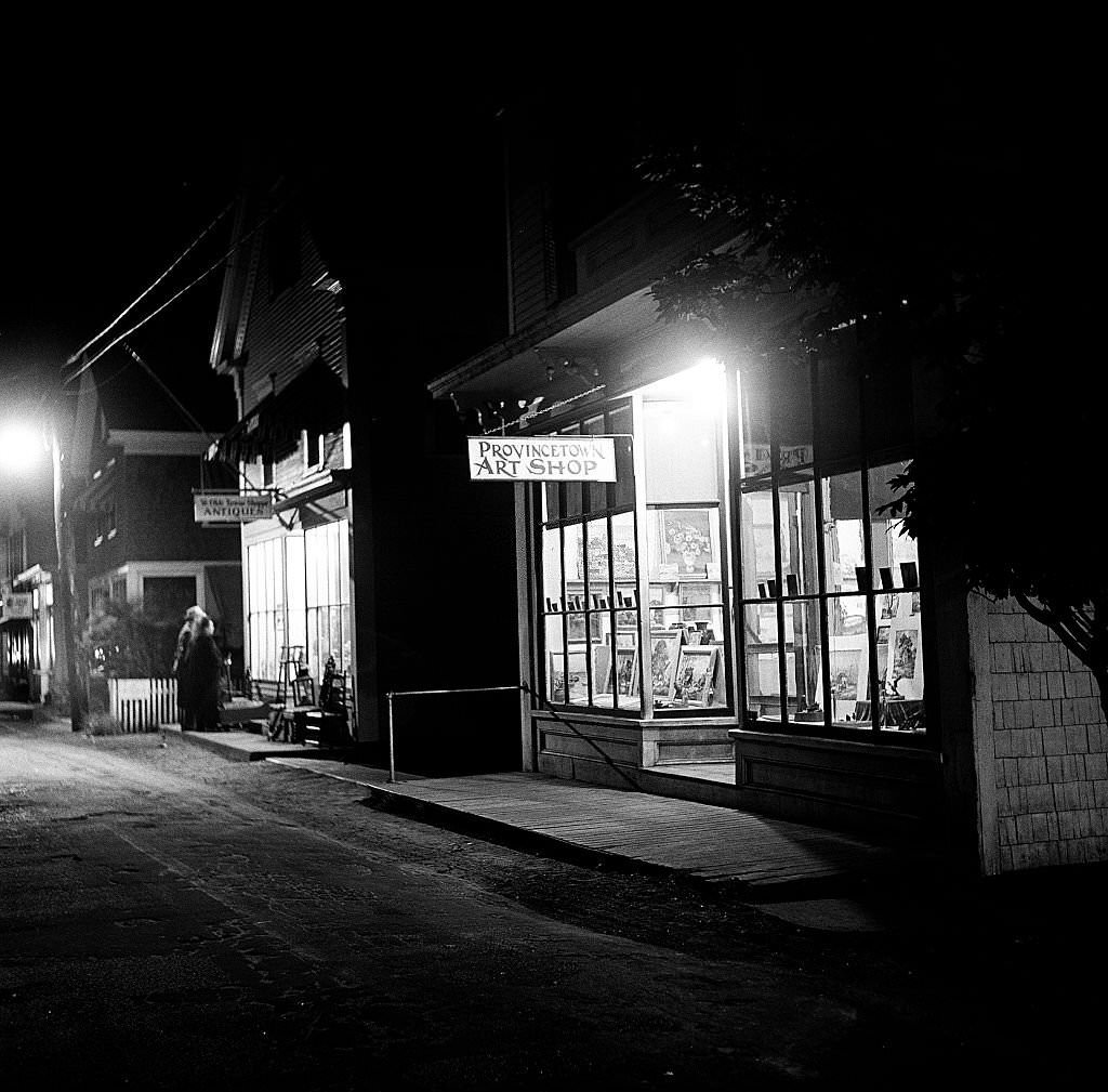 Night time view showing the window of the Provincetown Art Shop, Provincetown, Massachusetts, 1948.