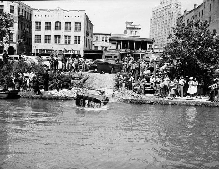 Amphibious jeep entering San Antonio River between St. Mary's and Navarro Streets, 1943