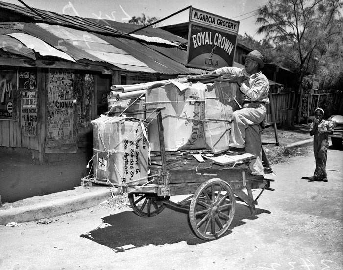 Luz Diaz Deleon with his garbage pushcart, 1947