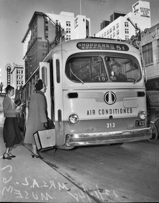 Mrs. A.L. Muse boarding 'shoppers special' bus, 1948