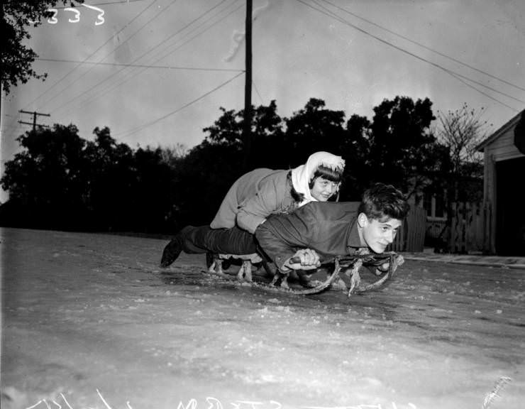 Sledding in San Antonio? Kay Hornaday and Ray Conder ride a snow sled down an icy hill in Alamo Heights, 1946