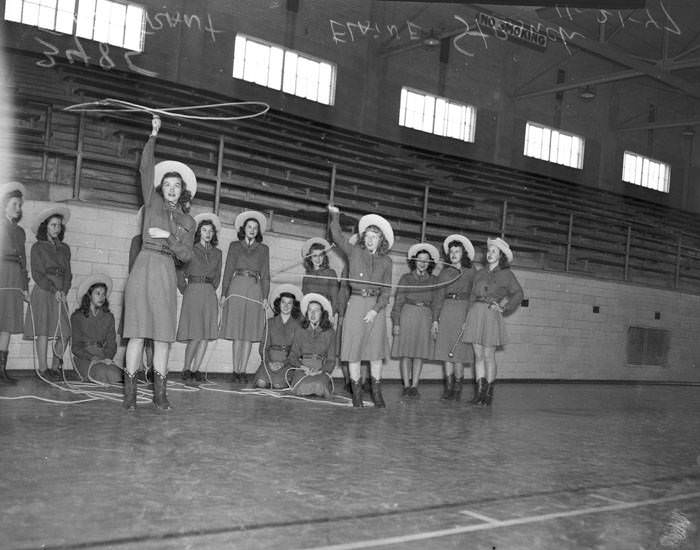 Jefferson High School Lassos practicing twirling lassos in a gymnasium, 1947