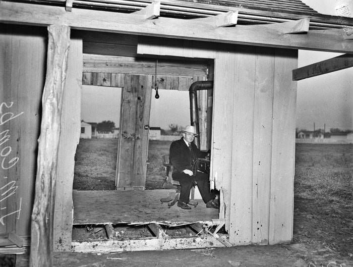 Aftermath of automobile driving through small office, 1941