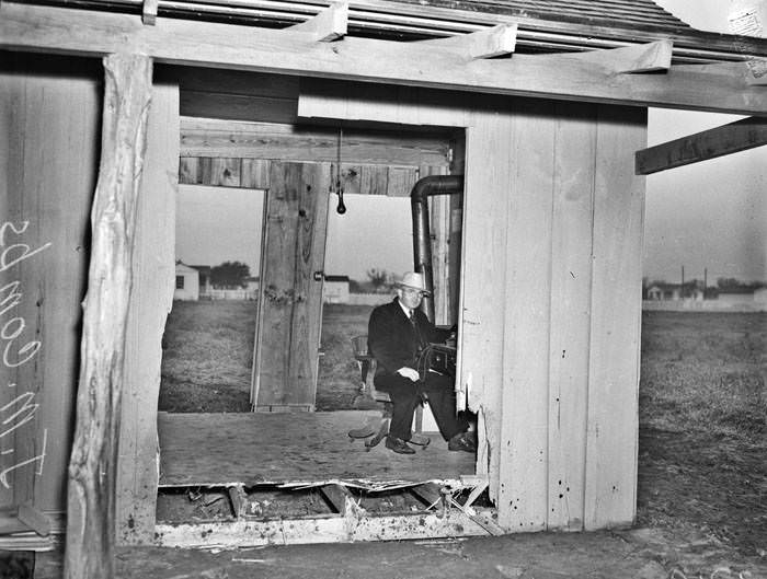 Aftermath of automobile driving through small office, 1941