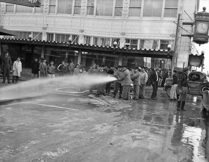 Firemen cleaning street after snow and ice storm, San Antonio, 1949