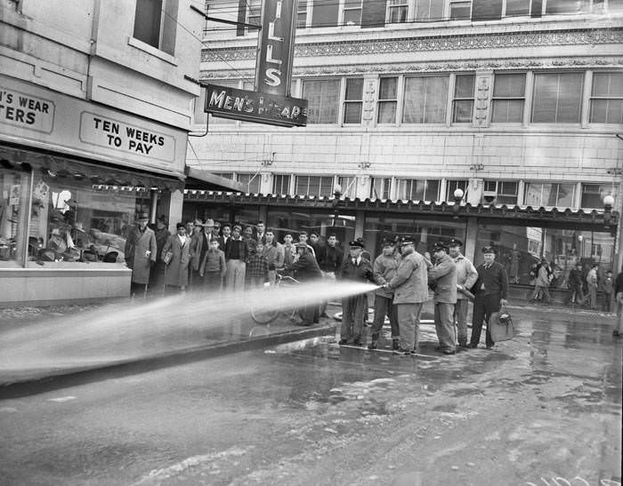 Firemen cleaning street after snow and ice storm, San Antonio, 1949