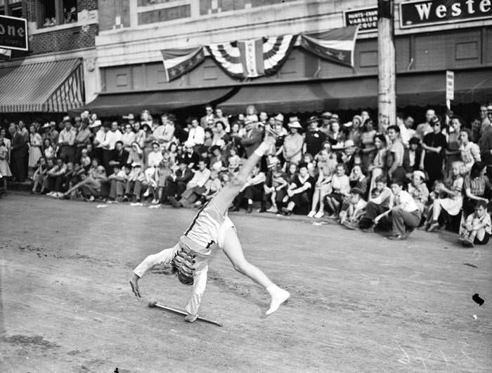 1940 Battle of Flowers Parade - Drum major turning cartwheel, 1940