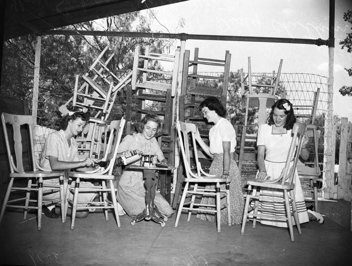 Volunteers refinishing chairs, 1943