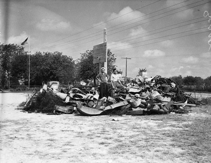 Scrap metal pile at Leon Springs school, 1942