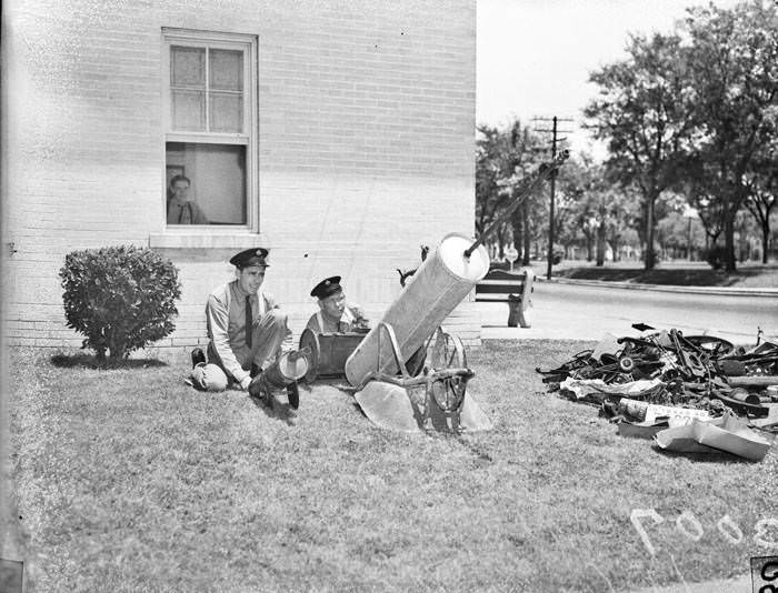 M.B. Goodwin and L.E. Cox with scrap metal guns, 1947