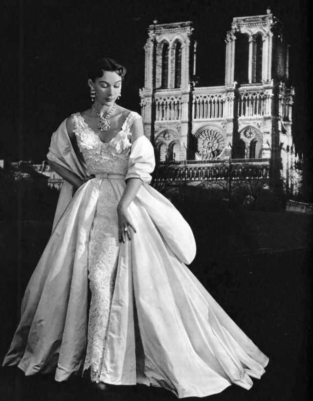 Sophie Malgat in white Marescot lace sheath enveloped in skirt and stole of white faille by Lucille Manguin, 1951