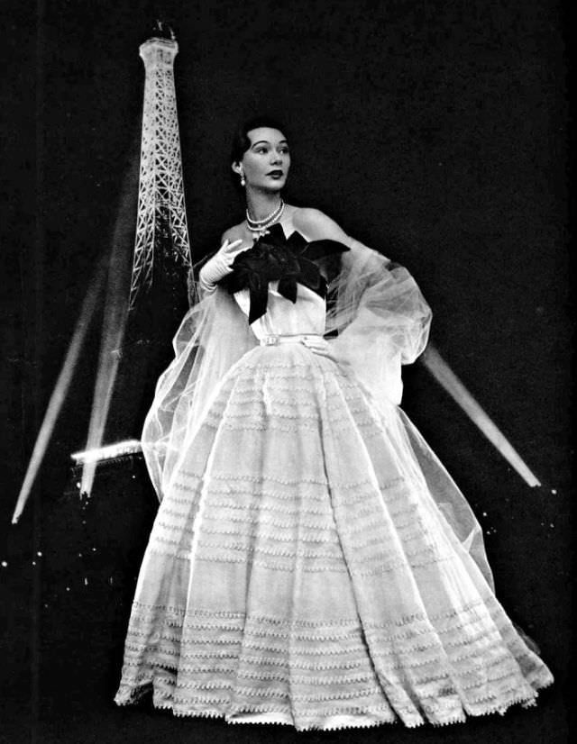Sophie Malgat in white organdy gown adorned with red roses by Jacques Fath, 1951