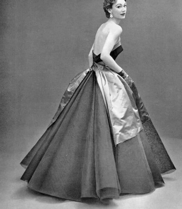 Sophie Malgat in black tulle and lace ball gown adorned with blue satin sash, by Elsa Schiaparelli, 1952