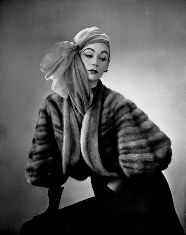 Sophie Malgat in short mink bolero by Maurice Kotler, wrapped mousseline turban by Maud e Nano, 1952