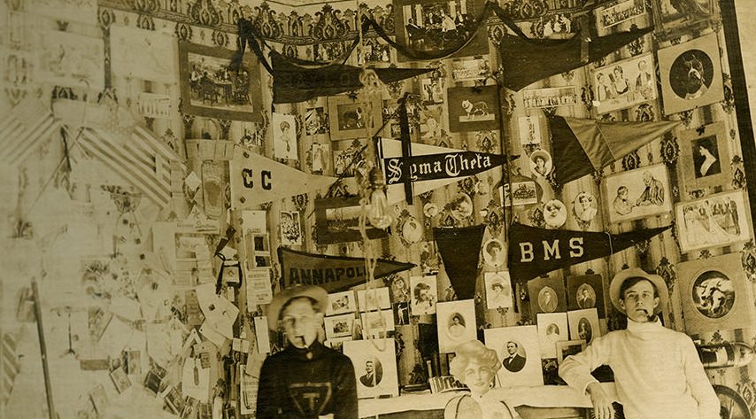 Male students with pipes in dorm room, Baylor University, 1910