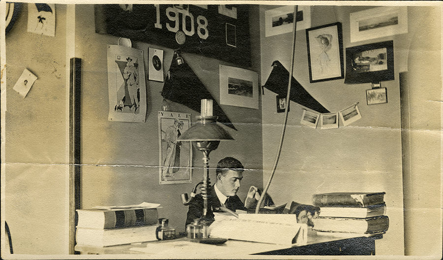 A Baylor student at desk in dorm room, 1910