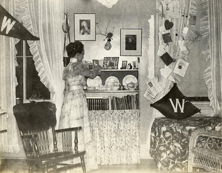 This woman’s dorm room from 1898 isn’t much different from modern day dorms: Pennants, books, and a chair for studying.