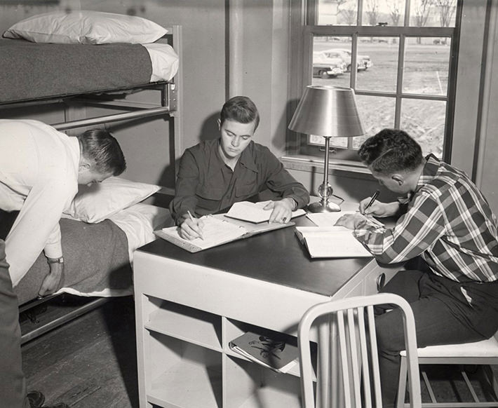 Students studied around a communal table, 1950s.
