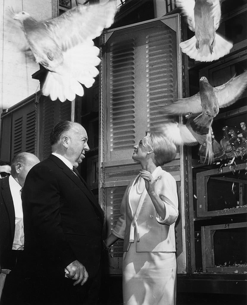 Tippi Hedren and Alfred Hitchcock release 1,000 pigeons at the RKO Palace Theater in New York City to mark the opening of Hitchcock's film, 'The Birds,' 1963