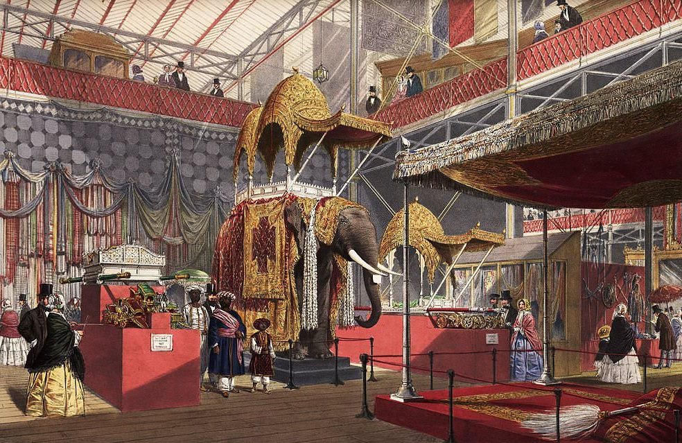 A coloured lithograph of a model elephant with howdah in the Indian Court in the Crystal Palace, Hyde Park, London, 1851.