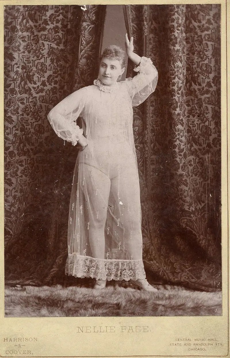 Nellie Page posing in a nightgown.