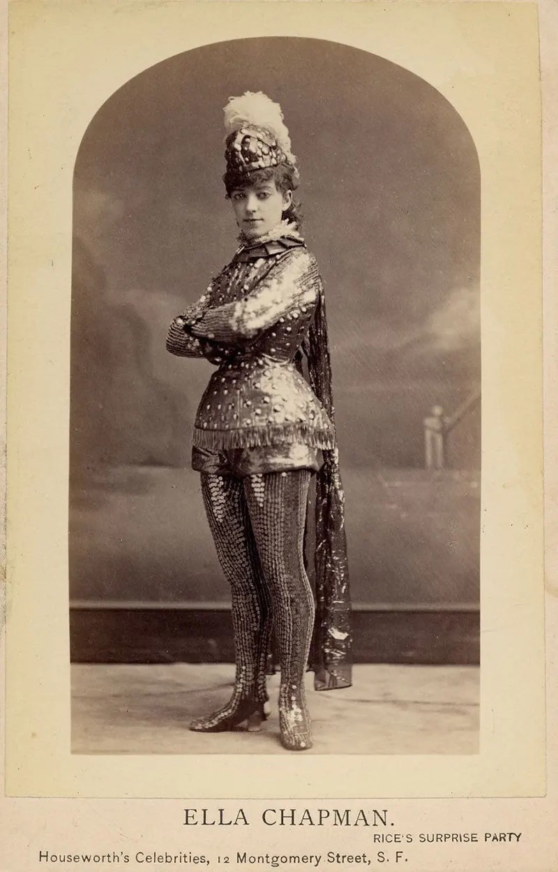 Ella Chapman in short metallic armor costume, including leggings, helmet with feather. Rice’s surprise party.