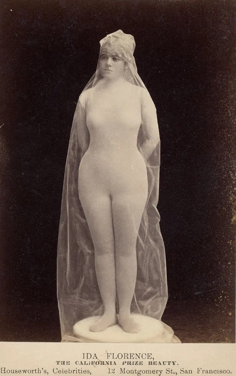 Ida Florence, “The California Prize Beauty,” in body stocking covered with transparent fabric, posed as statue.