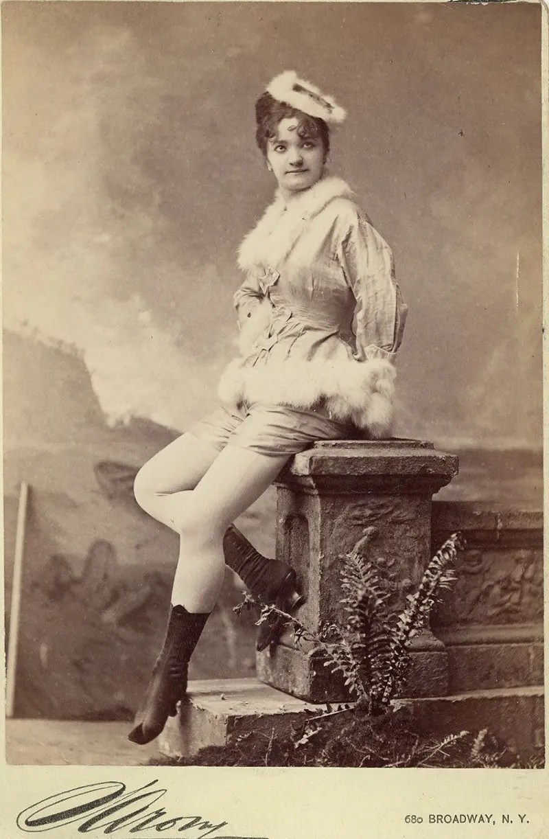 Elvira Viola, sitting in fur fringe.