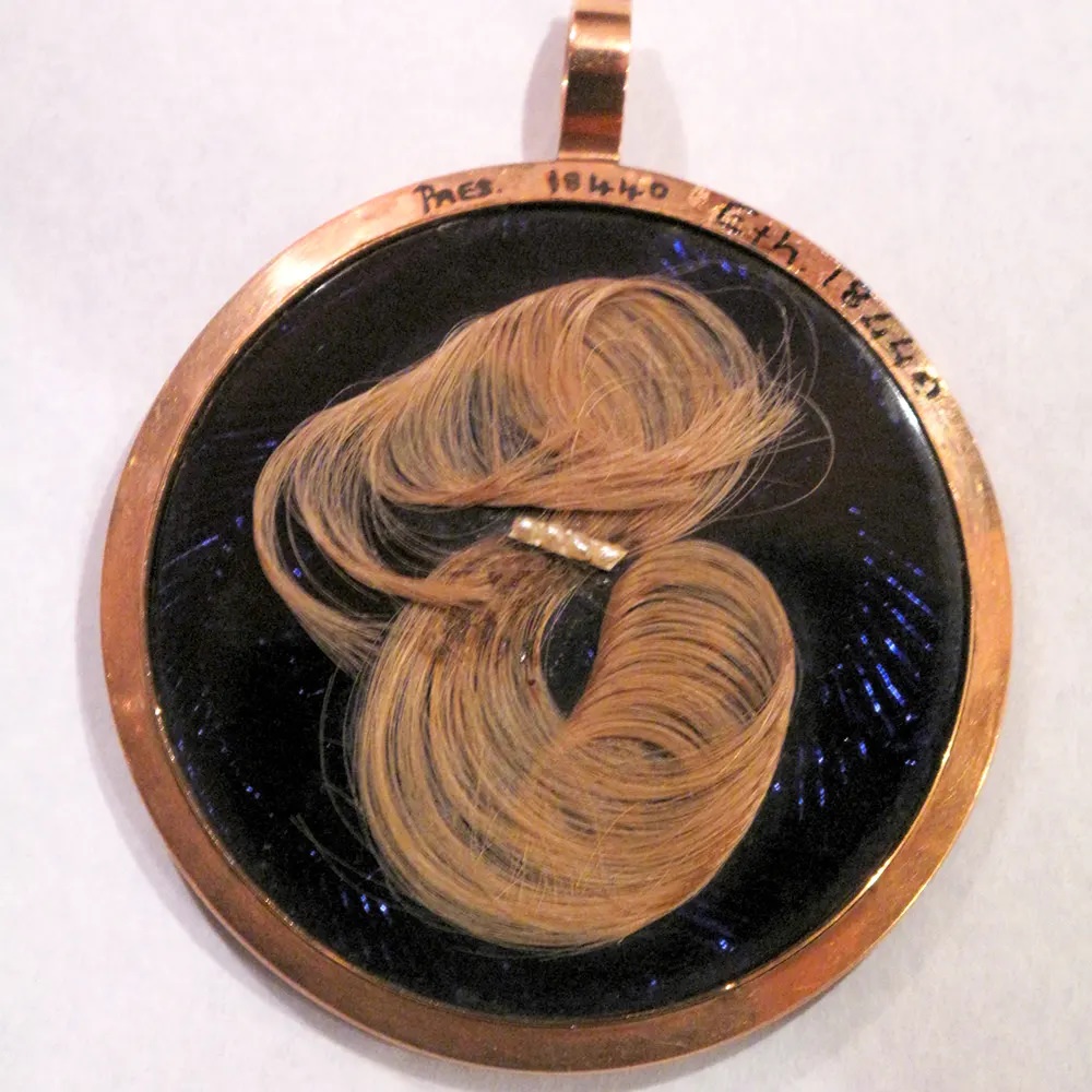 Hair mourning locket.