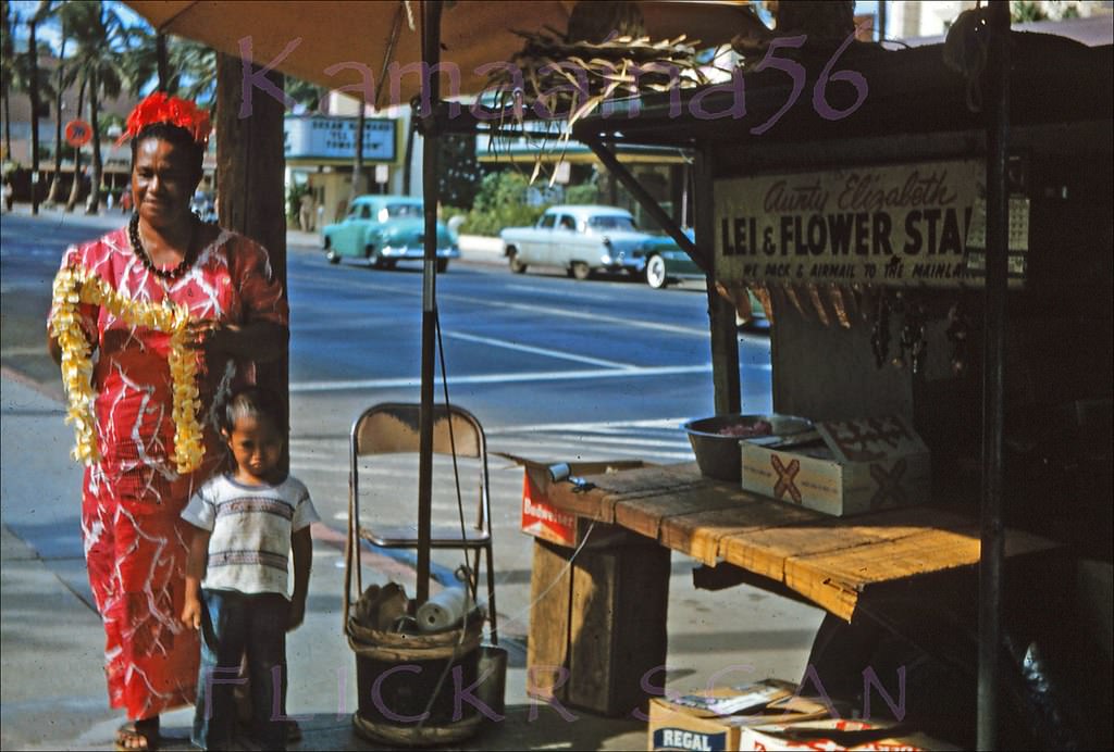 A bit shaky but still interesting snap of Kalakaua Avenue seen from a truck lei stand on the street front of the Royal Hawaiian Hotel looking towards the old Waikiki Theater, 1956