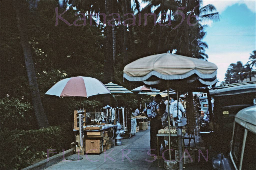 Vendors on the sidewalk of Waikiki’s Kalakaua Avenue in front of the Royal Hawaiian Hotel, 1959.