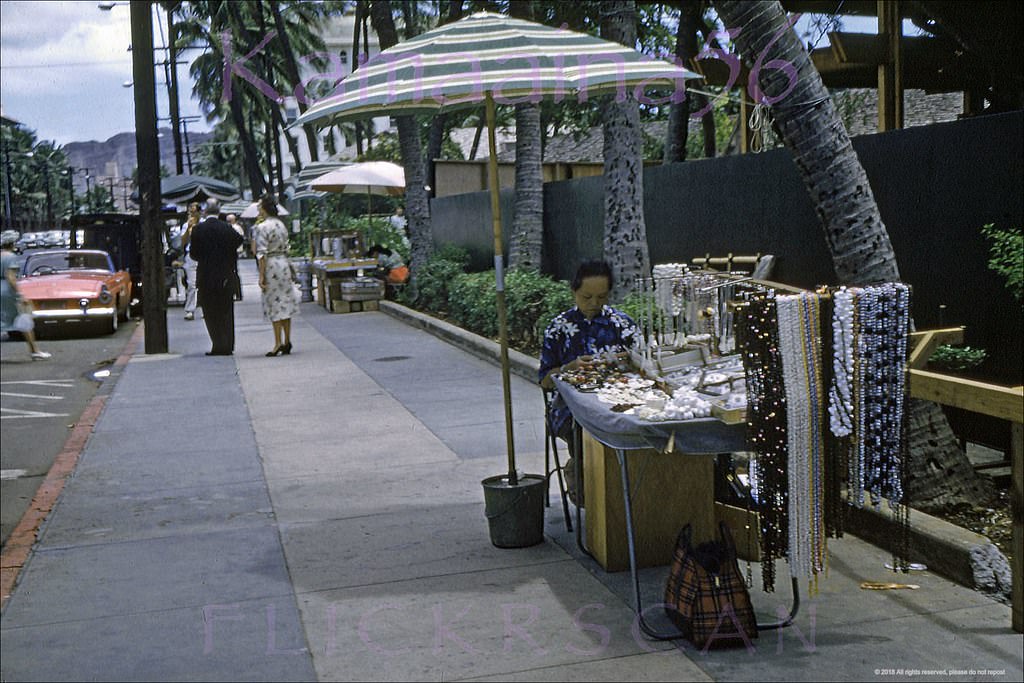 Looking Diamond Head (more less east) along Waikiki’s Kalakaua Avenue from in front of the Royal Hawaiian Shopping Arcade, 1960s